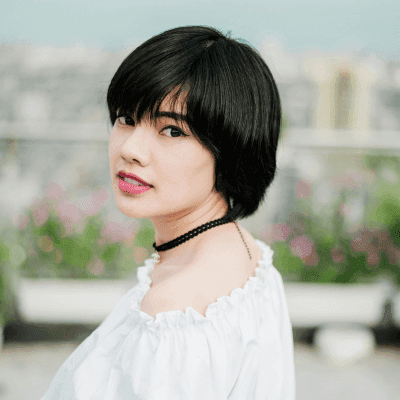 selective focus photo of woman wearing white top and black choker necklace