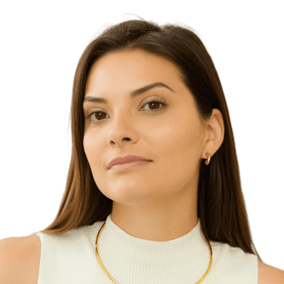 a woman wearing a white top and a gold necklace