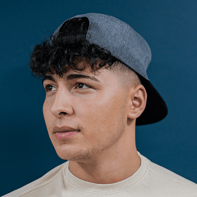 a young man wearing a hat and a t - shirt