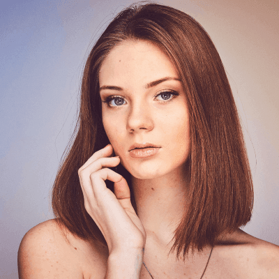 woman with her hand on cheek