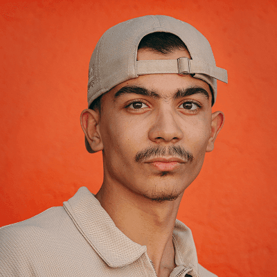 A man with a mustache wearing a hat