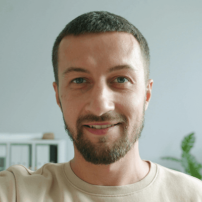 Man smiling at the camera in an office