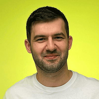 A man in a white shirt pointing at something