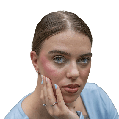 A woman gazes at the camera with her hand on cheek.