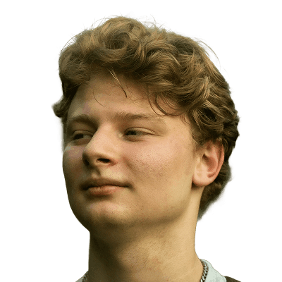 A young man with a backpack and a frisbee in his hand