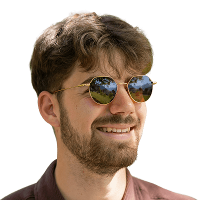 A man in a brown shirt and sunglasses