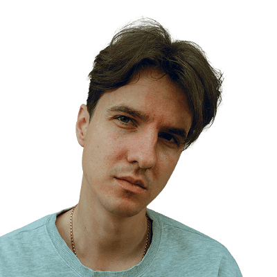 a man sitting down with his hands on his hips