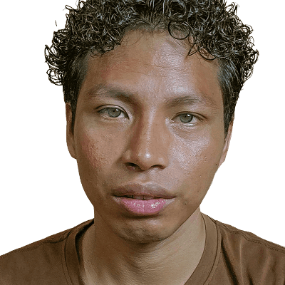 A man with curly hair looks directly at the camera.