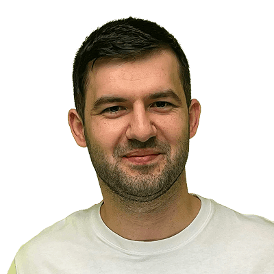 A man in a white shirt pointing at something