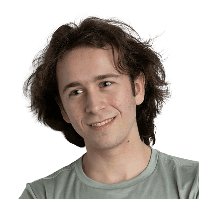 A man with his arms crossed posing for a picture